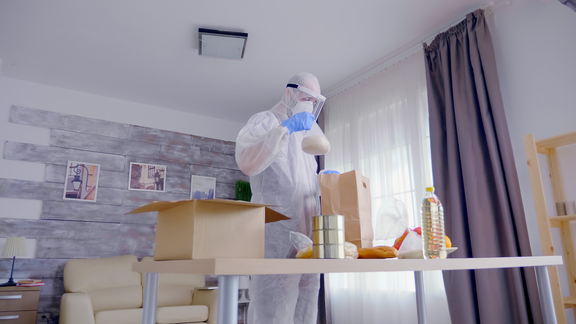 man in protective suit packing food 2023 11 27 04 57 28 utc Large